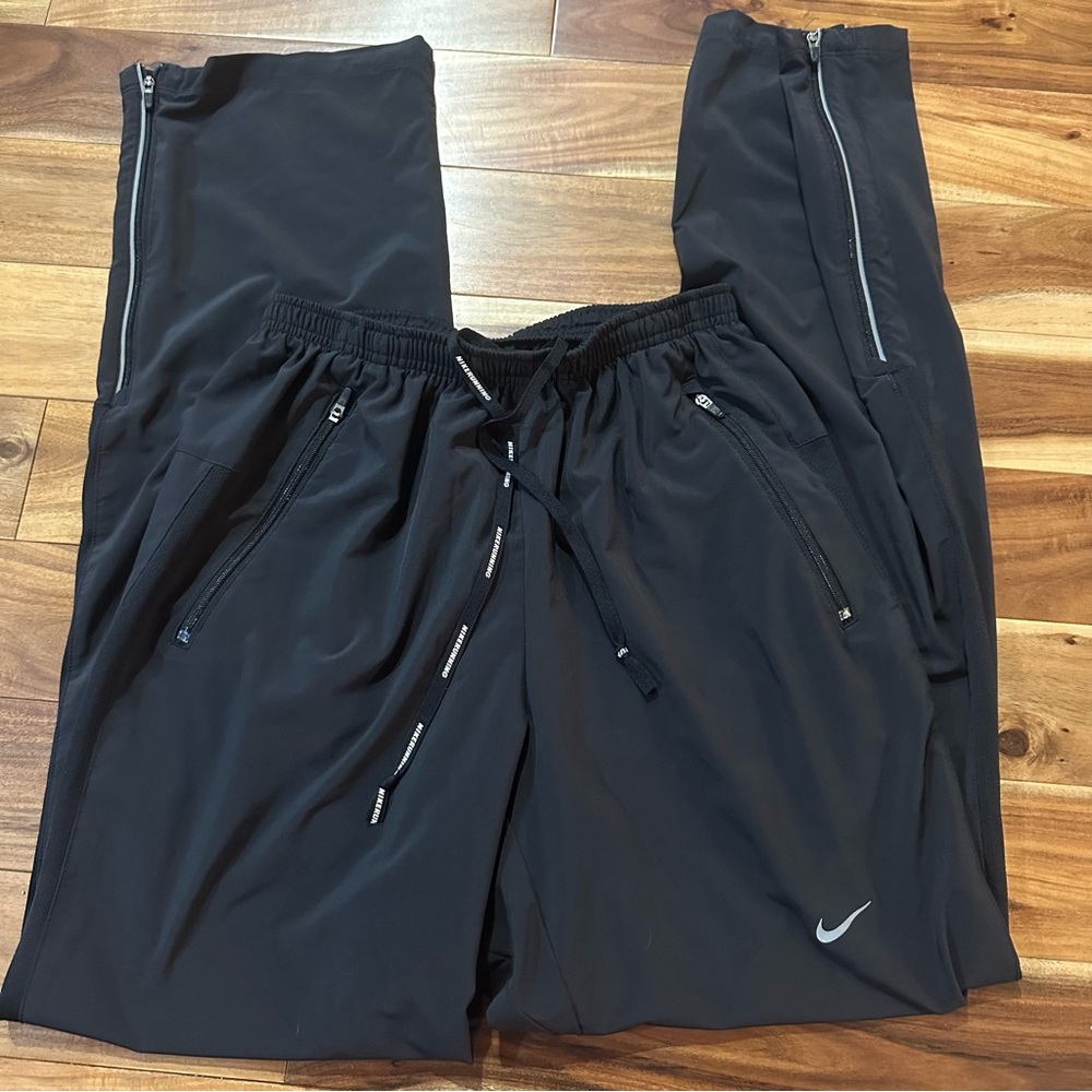 Nike Running track pants with ankle zippers. Size Small.